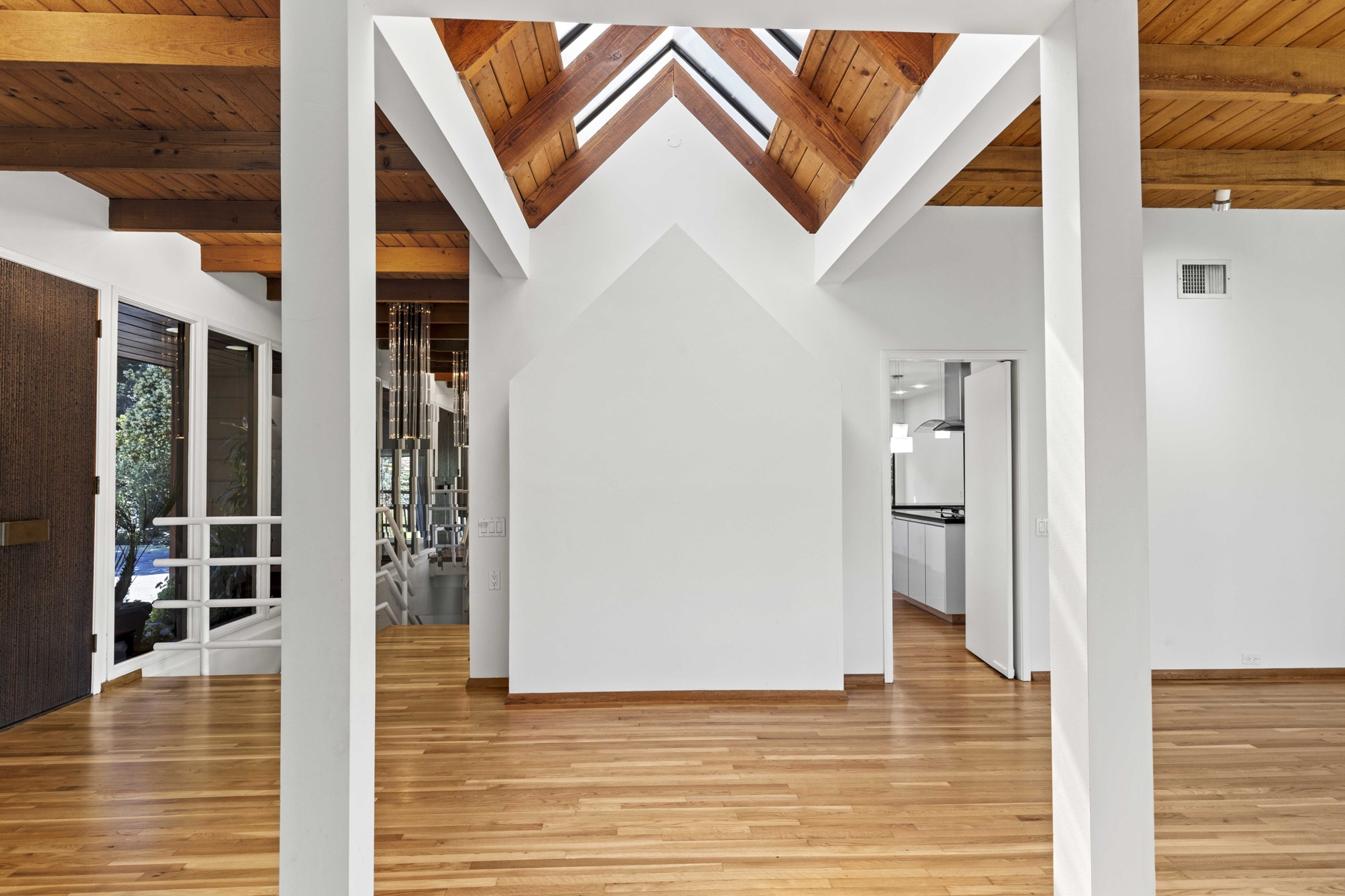 2- entry with vaulted ceiling with sky lights